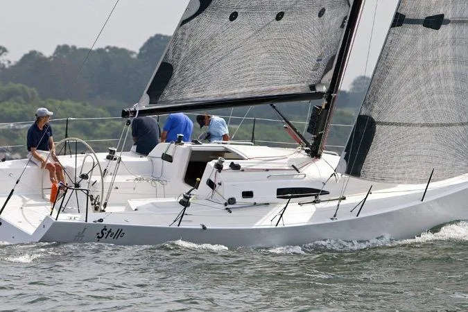 Elvis Yacht Photos Pics 2015 J Boats J 111 sailing on water with crew onboard.