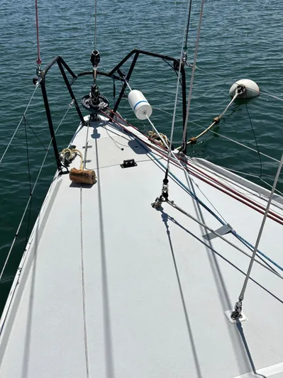 Ceilidh Yacht Photos Pics Bow of 2018 J Boats J/121 sailboat with rigging and calm water.