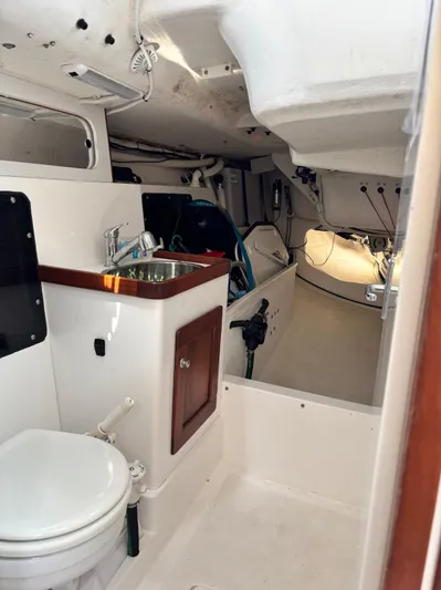 Ceilidh Yacht Photos Pics Interior of 2018 J Boats J/121 sailboat, featuring compact bathroom and sink area.