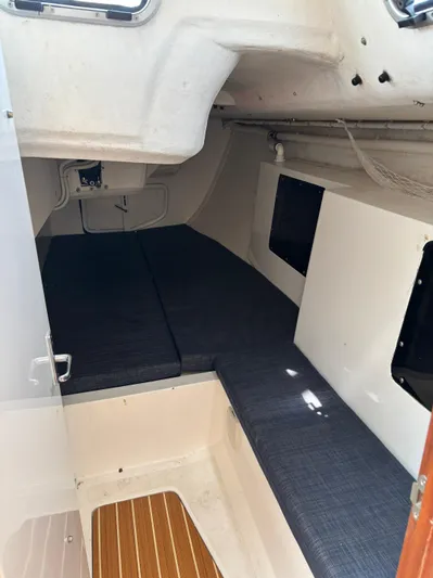 Ceilidh Yacht Photos Pics 2018 J Boats J/121 interior cabin with cushioned seating and wooden flooring.