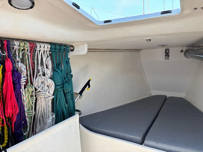 Ceilidh Yacht Photos Pics Interior of 2018 J Boats J/121 sailboat with ropes and cushions.