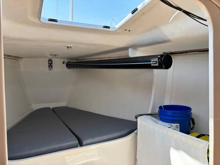 Ceilidh Yacht Photos Pics Interior cabin of 2018 J Boats J/121 sailboat with cushions and storage.