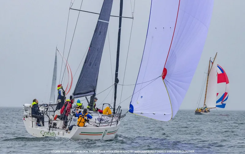 Ceilidh Yacht Photos Pics 2018 J Boats J/121 sailing in a regatta with colorful spinnaker and crew.