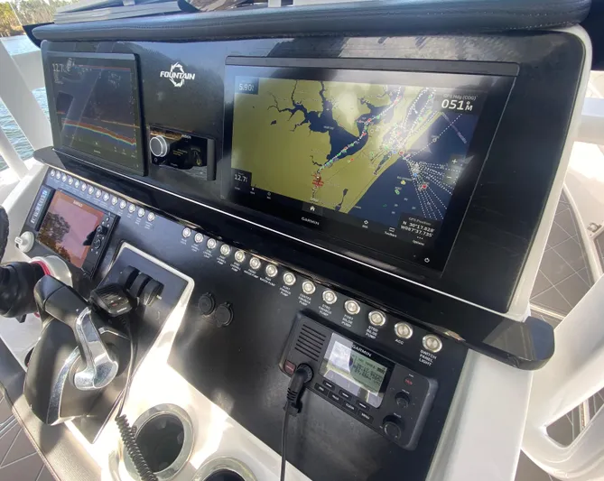  Yacht Photos Pics Close-up of the 2022 Fountain 34 Tournament Edition boat's navigation and control panel.