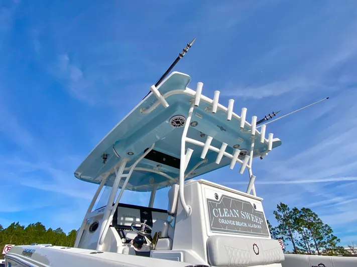  Yacht Photos Pics 2022 Fountain 34 Tournament Edition boat with fishing rods against a clear blue sky.