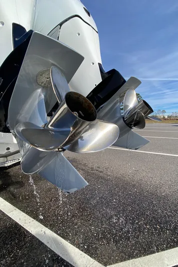  Yacht Photos Pics 2022 Fountain 34 Tournament Edition boat propellers in a parking lot.