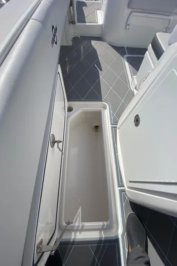  Yacht Photos Pics 2022 Fountain 34 Tournament Edition boat interior storage compartment.