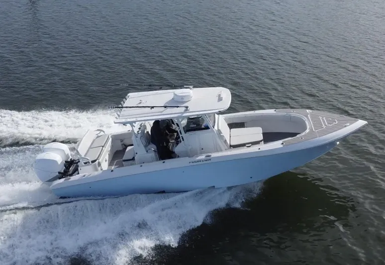  Yacht Photos Pics 2022 Fountain 34 Tournament Edition boat cruising on water.