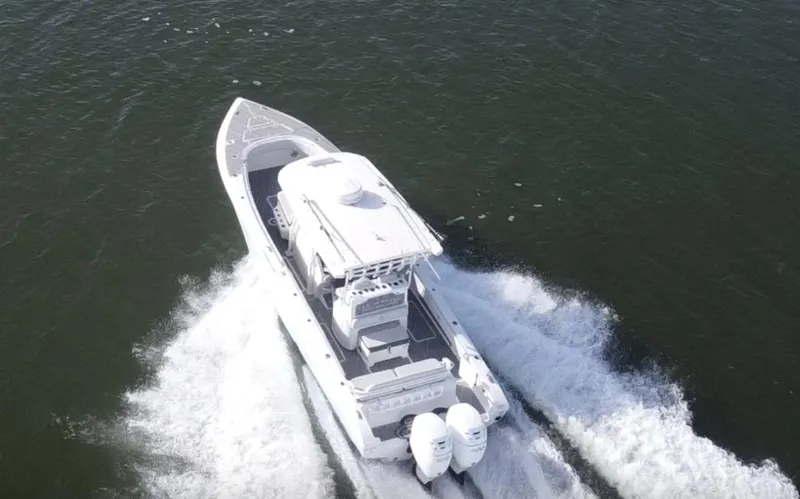  Yacht Photos Pics 2022 Fountain 34 Tournament Edition boat cruising on open water.