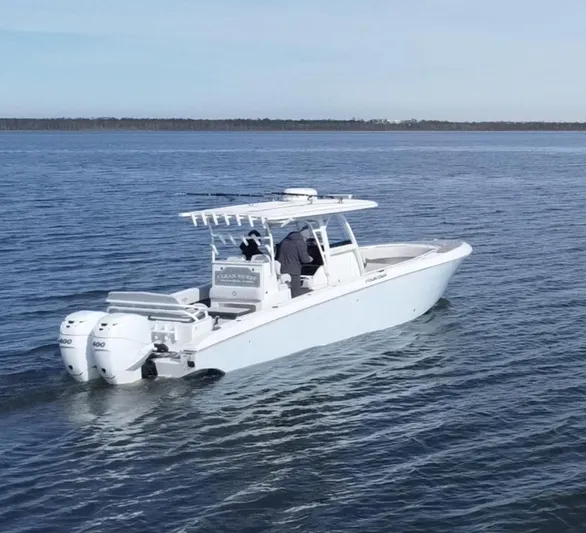  Yacht Photos Pics 2022 Fountain 34 Tournament Edition boat cruising on open water.