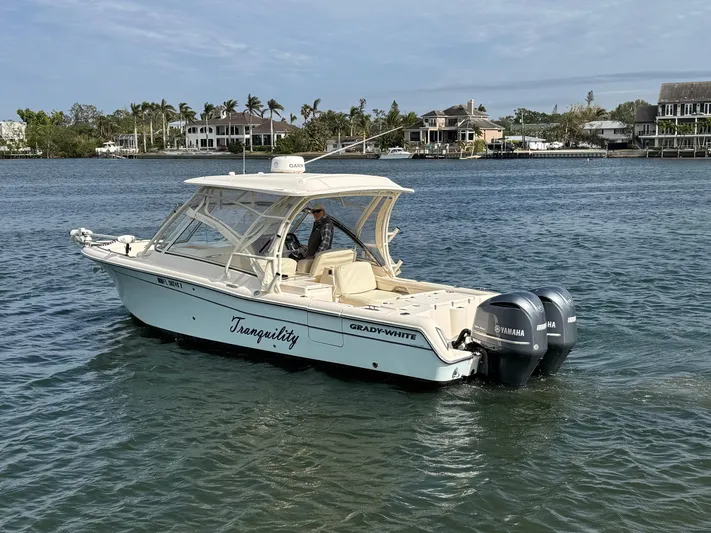 Tranquility Yacht Photos Pics 2021 Grady-White Freedom 285 boat on water, featuring dual Yamaha engines.