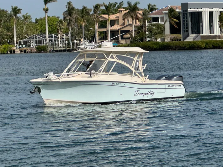 Tranquility Yacht Photos Pics 2021 Grady-White Freedom 285 boat named Tranquility on a calm waterway.