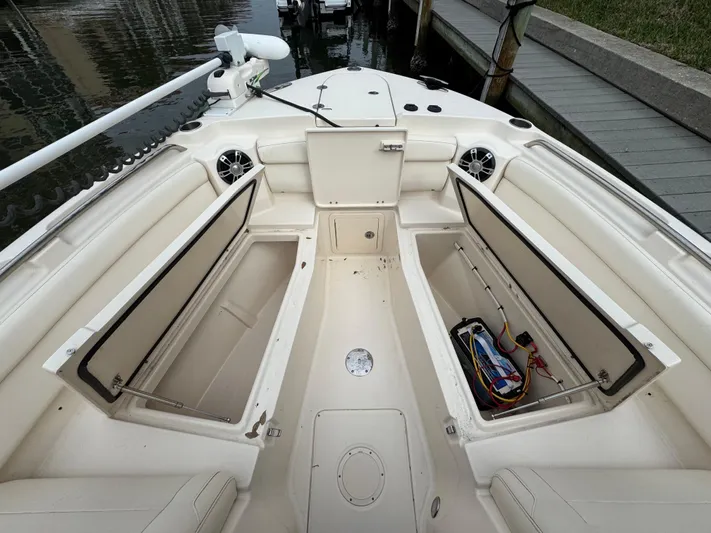 Tranquility Yacht Photos Pics 2021 Grady-White Freedom 285 boat interior with open storage compartments.