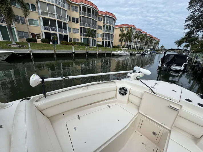 Tranquility Yacht Photos Pics 2021 Grady-White Freedom 285 boat docked near waterfront apartments.