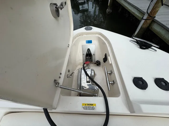 Tranquility Yacht Photos Pics 2021 Grady-White Freedom 285 boat anchor compartment open at dock.