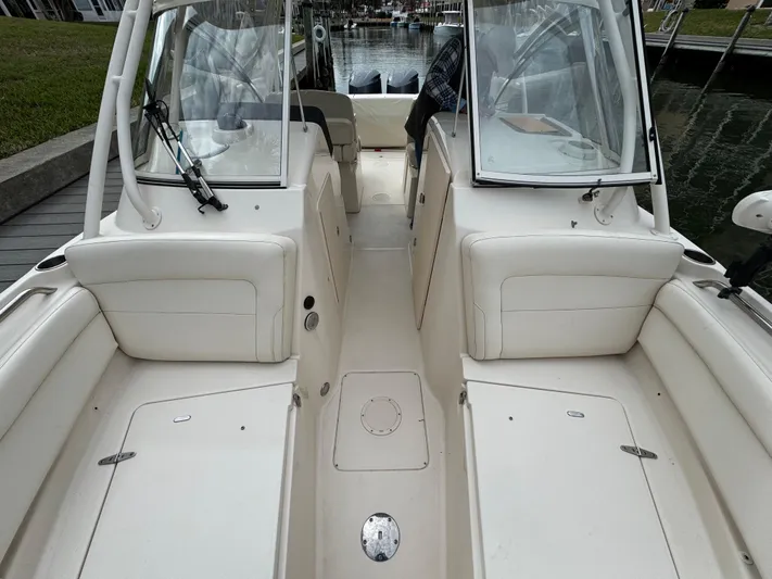 Tranquility Yacht Photos Pics 2021 Grady-White Freedom 285 boat interior with dual consoles and seating.