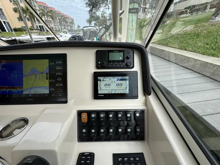 Tranquility Yacht Photos Pics Dashboard of 2021 Grady-White Freedom 285 boat with navigation and control panels.