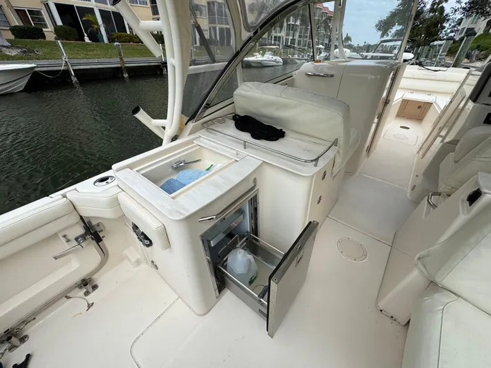 Tranquility Yacht Photos Pics 2021 Grady-White Freedom 285 boat interior with open storage and seating area.