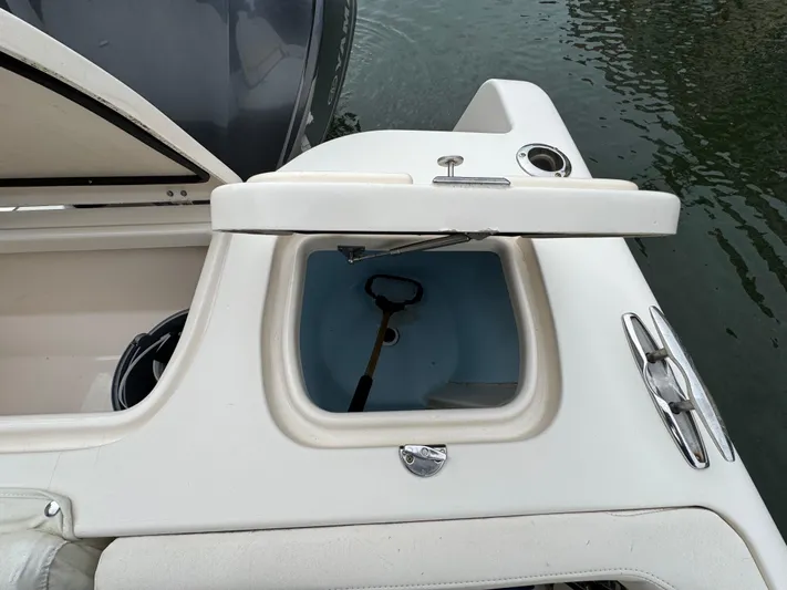 Tranquility Yacht Photos Pics 2021 Grady-White Freedom 285 boat with open storage compartment.