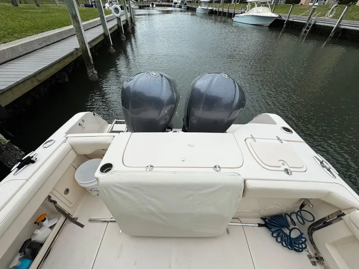 Tranquility Yacht Photos Pics 2021 Grady-White Freedom 285 boat with dual engines docked in a marina.