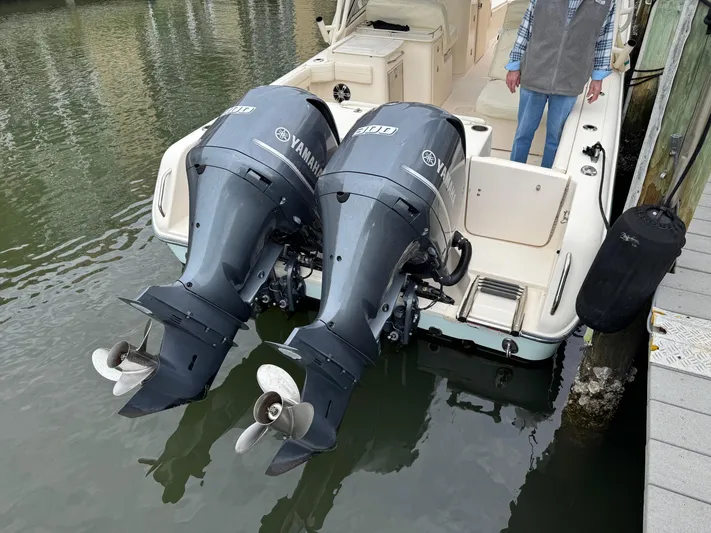 Tranquility Yacht Photos Pics 2021 Grady-White Freedom 285 boat with twin Yamaha outboard engines docked.