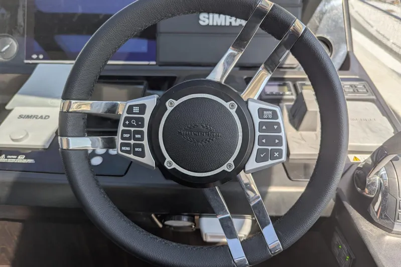 Yacht Photos Pics Steering wheel of 2022 Sunseeker Predator 55 EVO yacht with Simrad controls.