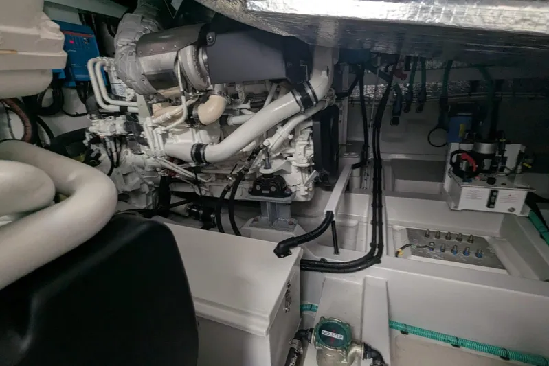  Yacht Photos Pics Engine room of 2022 Sunseeker Predator 55 EVO yacht, showcasing mechanical components and systems.