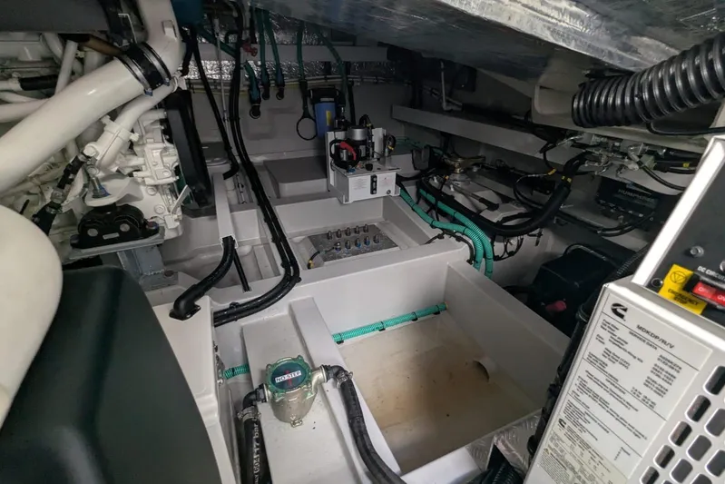  Yacht Photos Pics Engine room of 2022 Sunseeker Predator 55 EVO yacht, showcasing complex machinery and wiring.