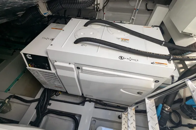  Yacht Photos Pics Engine room of 2022 Sunseeker Predator 55 EVO yacht, featuring Cummins Onan generator.