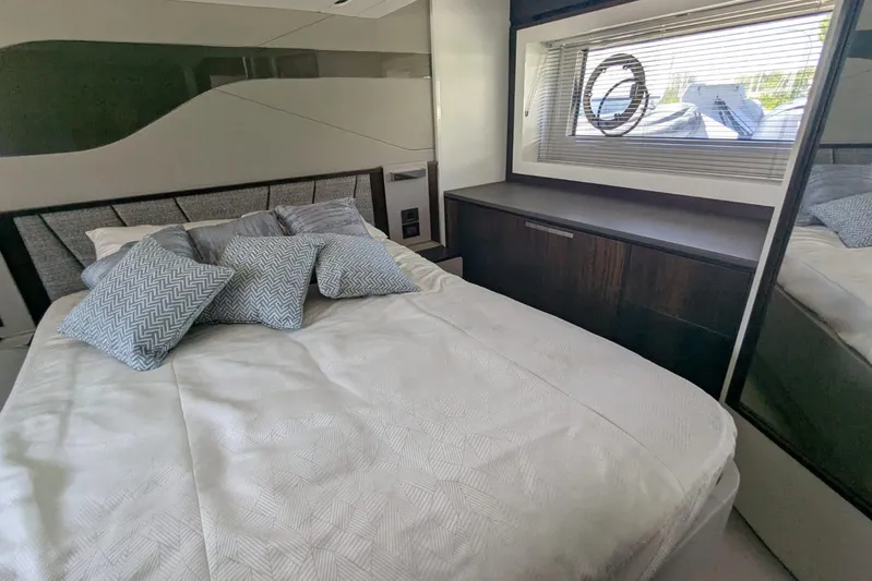  Yacht Photos Pics Luxurious bedroom interior of 2022 Sunseeker Predator 55 EVO yacht with modern design.