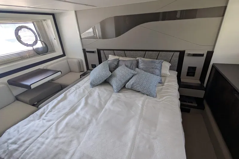  Yacht Photos Pics Luxurious bedroom interior of 2022 Sunseeker Predator 55 EVO yacht with modern design.