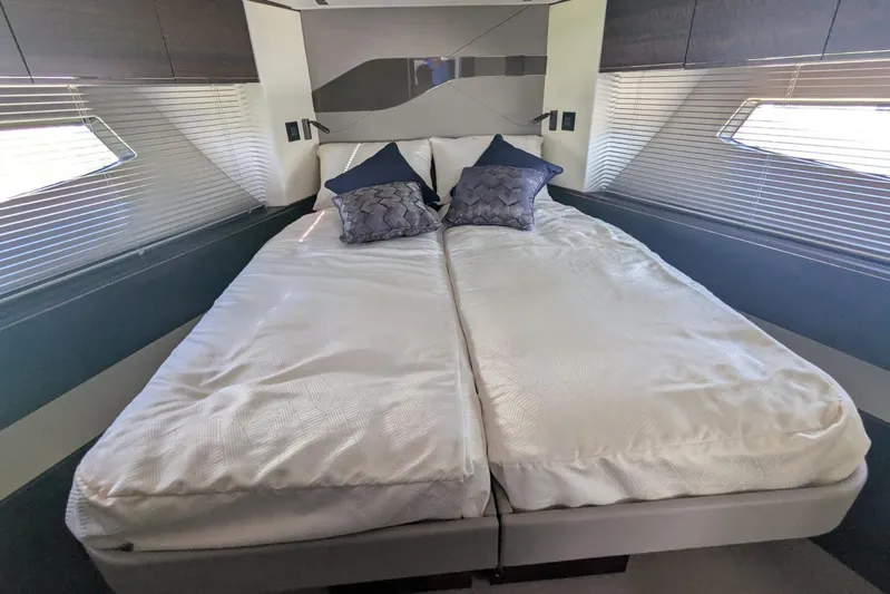  Yacht Photos Pics Luxurious bedroom interior of 2022 Sunseeker Predator 55 EVO yacht with modern design.