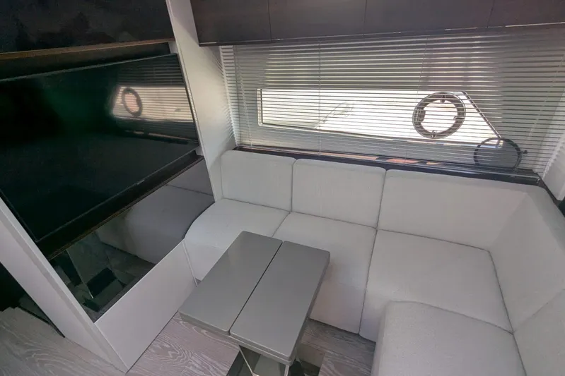  Yacht Photos Pics Interior of 2022 Sunseeker Predator 55 EVO yacht with modern seating and table.