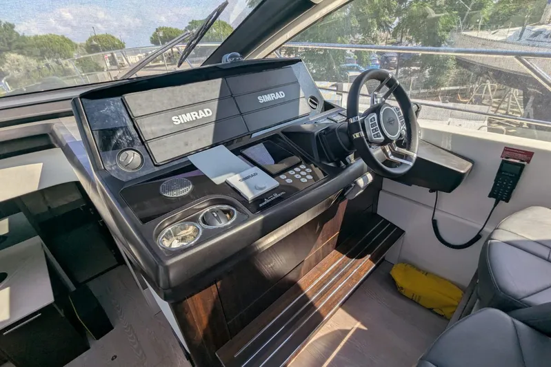  Yacht Photos Pics Helm of 2022 Sunseeker Predator 55 EVO yacht with Simrad navigation system.