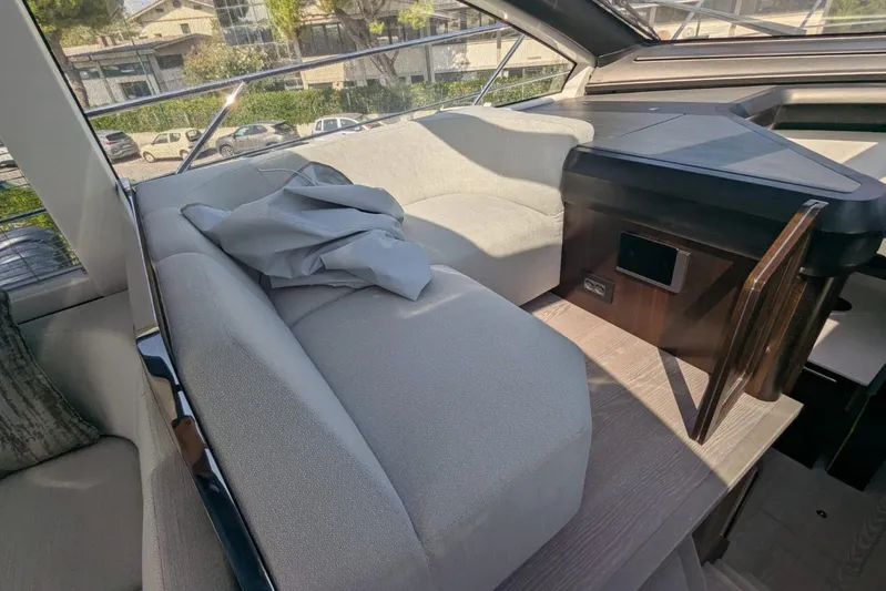  Yacht Photos Pics Luxurious interior of 2022 Sunseeker Predator 55 EVO yacht with plush seating.