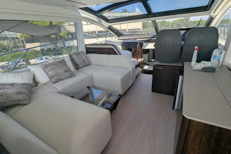  Yacht Photos Pics Luxurious interior of 2022 Sunseeker Predator 55 EVO yacht with plush seating and modern design.