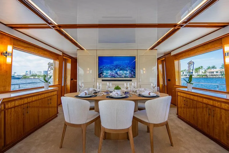 Carpe Diem Yacht Photos Pics Luxurious dining area on a 2001 Intermarine Raised Pilothouse yacht with waterfront views.