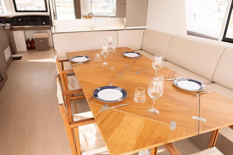 Tatani Yacht Photos Pics Luxurious dining area on 2021 Bali 4.8 yacht with elegant table setting.