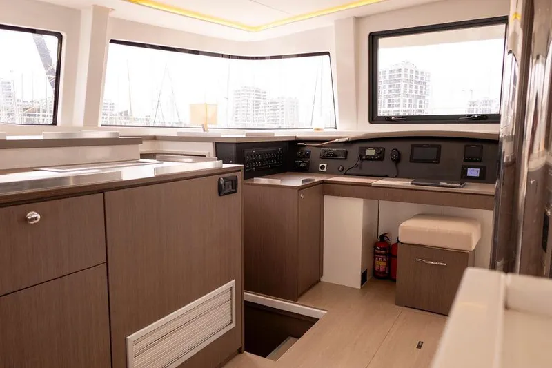 Tatani Yacht Photos Pics Interior of 2021 Bali 4.8 yacht with modern navigation equipment and wood finish.