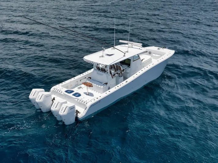 Sycorax Yacht Photos Pics 2024 Freeman 43 CC boat on open ocean, featuring dual outboard engines.