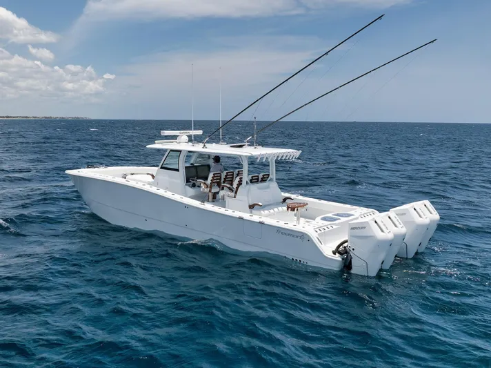 Sycorax Yacht Photos Pics 2024 Freeman 43 CC boat cruising on open ocean under clear skies.