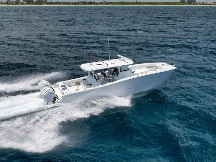 Sycorax Yacht Photos Pics 2024 Freeman 43 CC boat cruising on open water, showcasing sleek design and powerful engines.