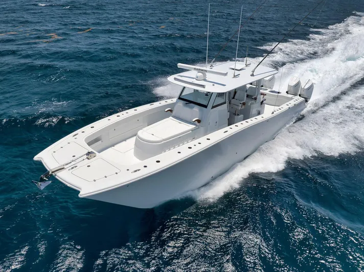 Sycorax Yacht Photos Pics 2024 Freeman 43 CC boat cruising on open ocean waters.