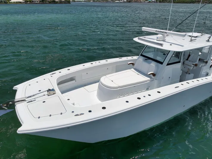 Sycorax Yacht Photos Pics 2024 Freeman 43 CC boat on clear water, showcasing sleek design and spacious deck.