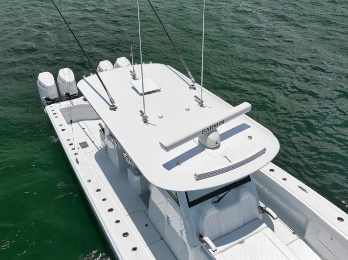 Sycorax Yacht Photos Pics 2024 Freeman 43 CC boat with four engines on open water.