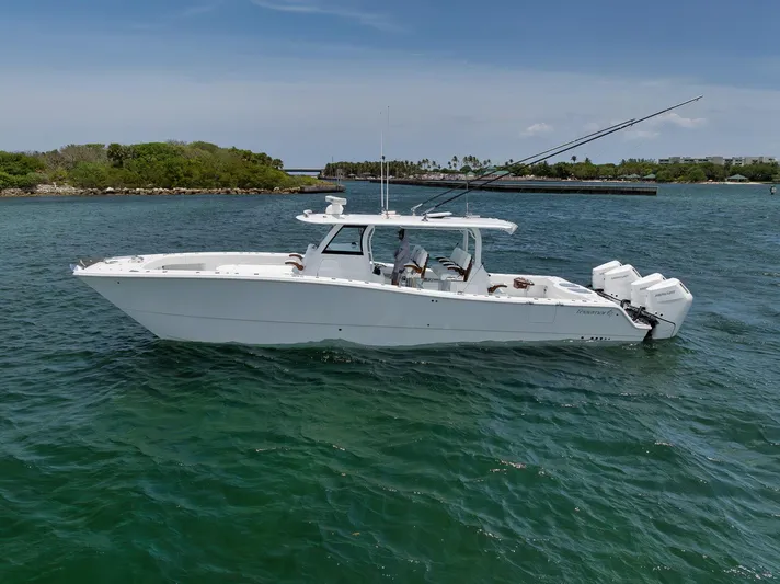 Sycorax Yacht Photos Pics 2024 Freeman 43 CC boat on calm water, featuring sleek design and powerful engines.