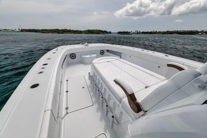 Sycorax Yacht Photos Pics 2024 Freeman 43 CC boat with spacious deck and seating, cruising on calm waters.