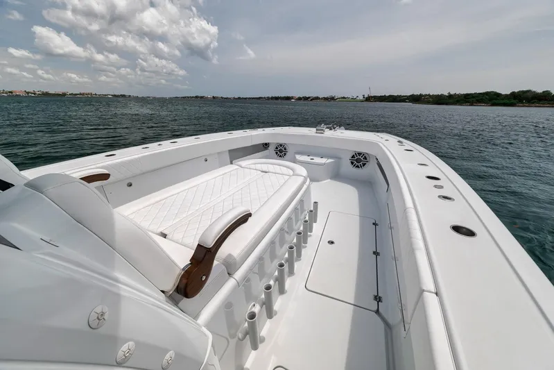 Sycorax Yacht Photos Pics 2024 Freeman 43 CC boat on water, featuring spacious deck and seating.