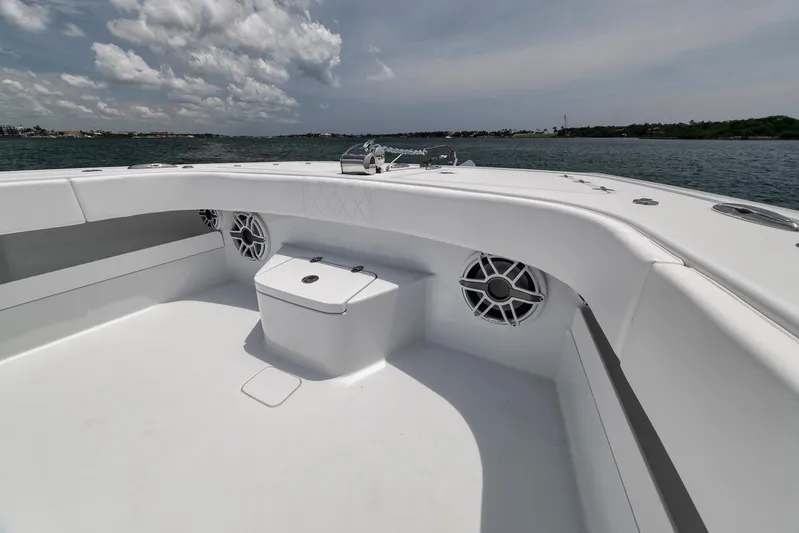 Sycorax Yacht Photos Pics 2024 Freeman 43 CC boat deck with seating and speakers, on a sunny day at sea.