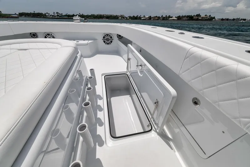 Sycorax Yacht Photos Pics 2024 Freeman 43 CC boat interior with storage compartment and rod holders on deck.